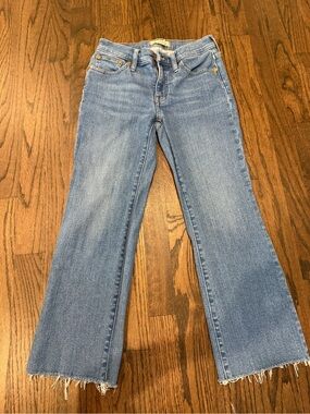 Madewell light blue flare jeans with frayed hem